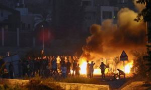 Arabs riots at the entrance to an Arab village. (Photo: Flash90)