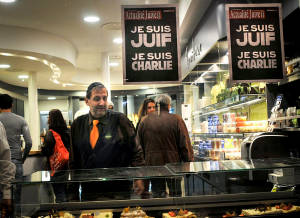 Signs reading "I am Charlie" and "I am Jewish" at a store in Paris. (Photo: Serge Attal/Flash90)