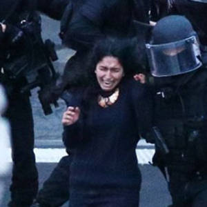One of the surviving hostages escorted by police. (Photo: screenshot)