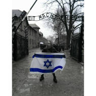 Girl Stands Outside Auschwitz Holding Israel Flag