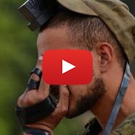 Israeli soldier praying wearing tefillin