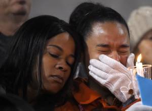 A woman cries during a candlelight vigil for Islamic terror victims last month in San Bernardino, Calif. (AP/Mark J. Terrill)